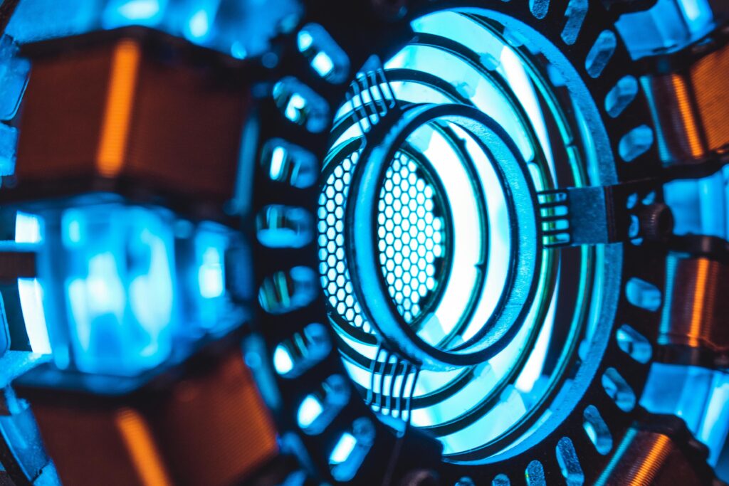 A detailed close-up of a glowing blue technology component with intricate designs.
